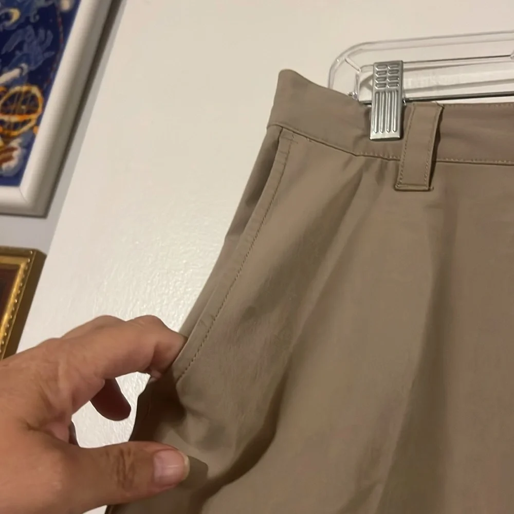 Banana Republic flat front tan shorts. Back elastic waist for comfort.